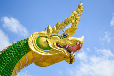 King of Naga statue on blue skyの写真素材