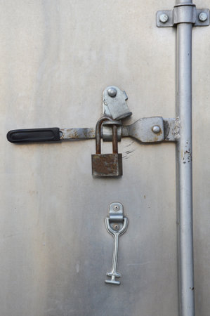 closed steel door with lockの写真素材