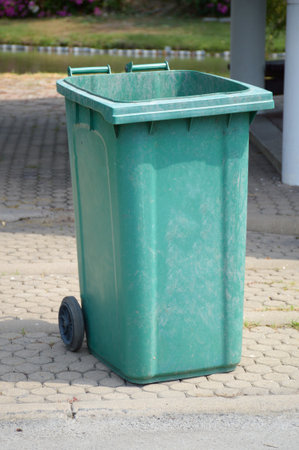 green plastic bin in nature gardenの写真素材