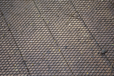 steel net on wood floor textureの写真素材