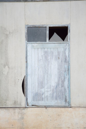 wood window on cement wallの写真素材