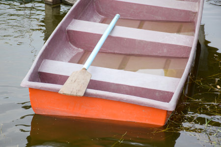 plastic boat on fish pondの写真素材