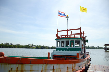 wooden fishing boat on the river
