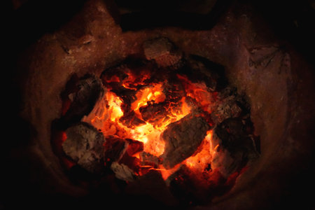 close up hot charcoal and fire in stoveの写真素材