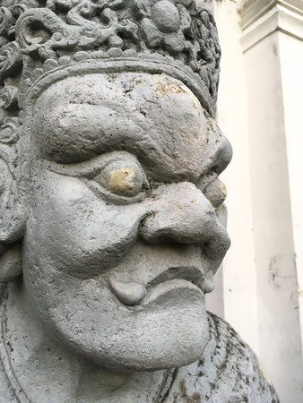 close up giant statue chinese style in public temple at thailandの写真素材