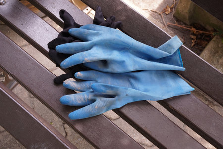 blue glove on wood chair
