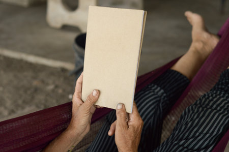 paper book on woman handの写真素材