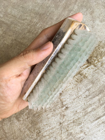 close up hand man and old brushの写真素材