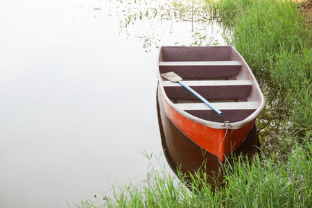 plastic boat on fish pondの写真素材