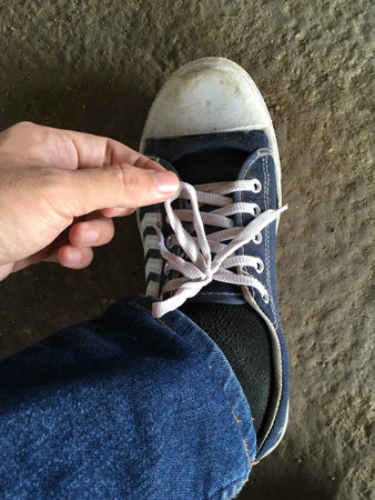 close up man hand and rope shoes