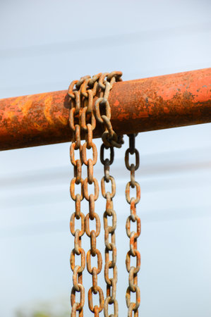 old chain on iron poleの写真素材