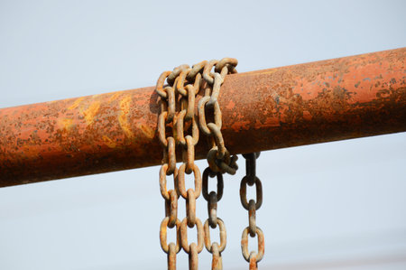 old chain on iron poleの写真素材