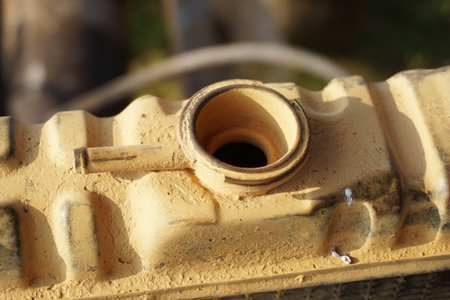 Close up old radiator cap under the hood of the carの写真素材