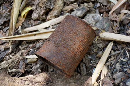 close up old rusty can on the ground