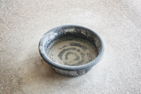 plastic bucket on the floor
