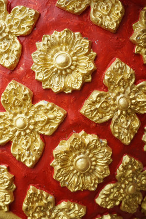 Close up art thai style on public temple wall at Thailandの写真素材