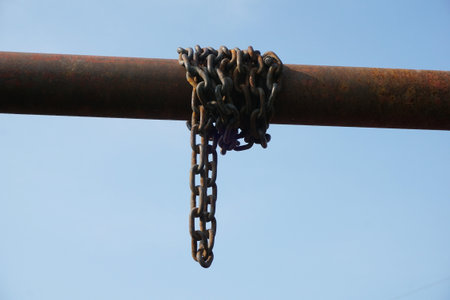 old chain on iron poleの写真素材