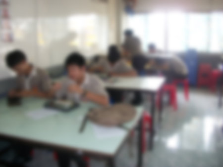 blurred student in classroom for backgroundの写真素材