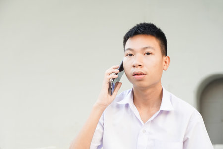 close up cute man use telephoneの写真素材