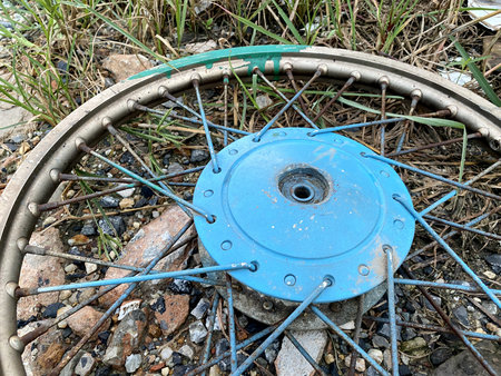 close up old wheel bicycle on the groundの写真素材