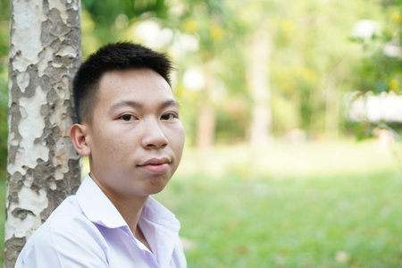 close up cute man in nature gardenの写真素材