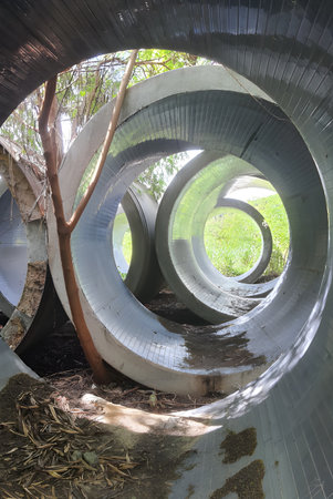 close up abandoned cement tube in country park