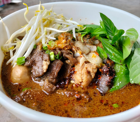thai food , spicy noodle pork with chicken and vegetables