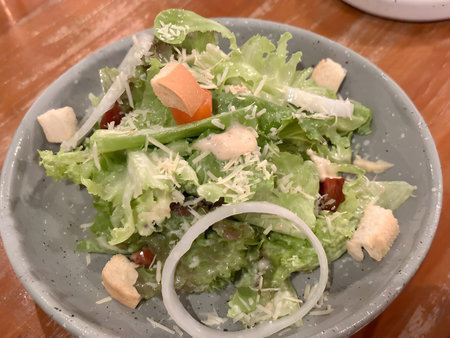 healthy eating salad with bread, vegetables and cheese and tomato sauceの写真素材