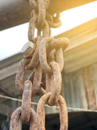 old rusty chains on a wooden background