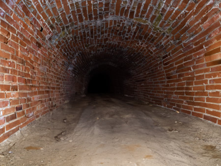 underground tunnel, old brick walls, light from the shadowの素材
