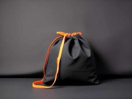 black leather bag on a dark background.の素材