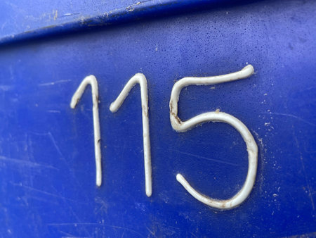number 115 on the wallの写真素材