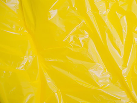 close up yellow plastic texture backgroundの素材