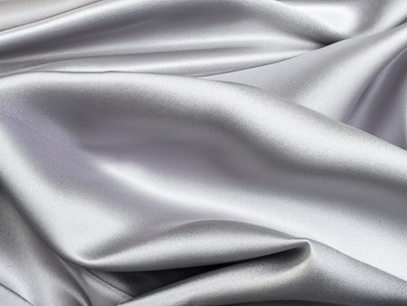 silver satin fabric texture background.の素材
