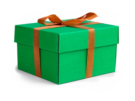 green christmas gift box with brown ribbon isolated on white background. christmas or birthday greeting card.の素材