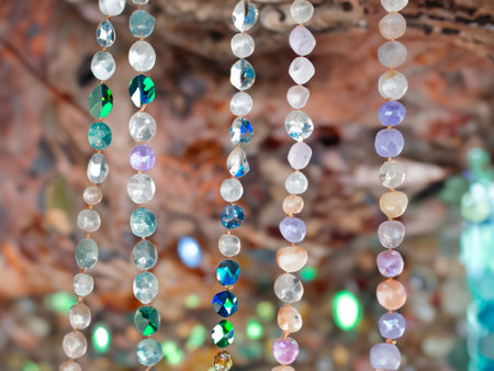 beautiful colorful crystal beads on a wooden backgroundの素材