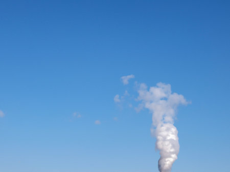 smoke from a pipe on blue sky.の素材