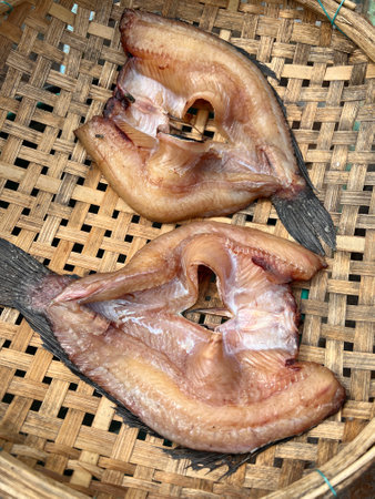 close up view of delicious asian food, dry fish on basket