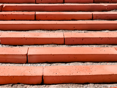 Red bricks made concrete stairs with shadows unique photoの素材