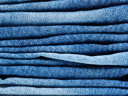 stack of blue jeans backgroundの素材
