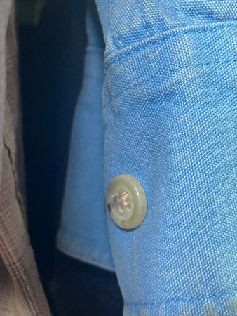 button with a jacket of a woman
