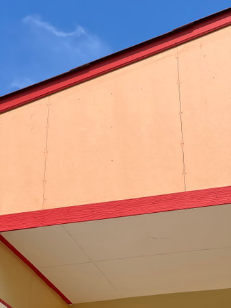 a vertical shot of the building under the sunlight