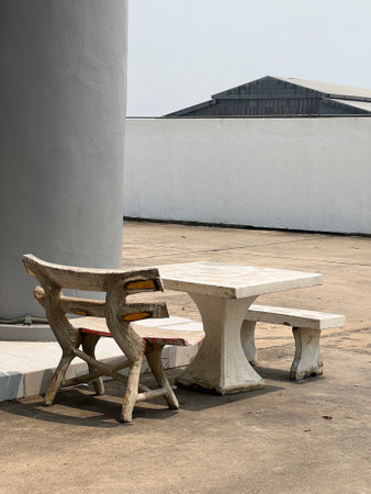 empty cement table and white wall