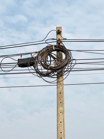 a telephone pole with a bunch of wires on it
