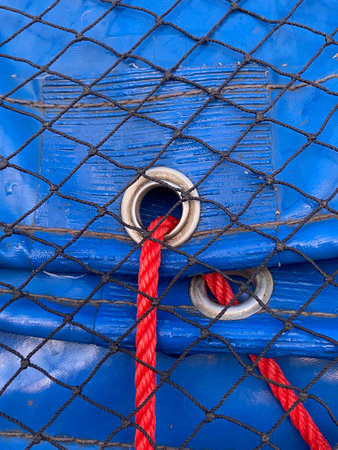 close shot of rope on blue fabric texture backgroundの写真素材