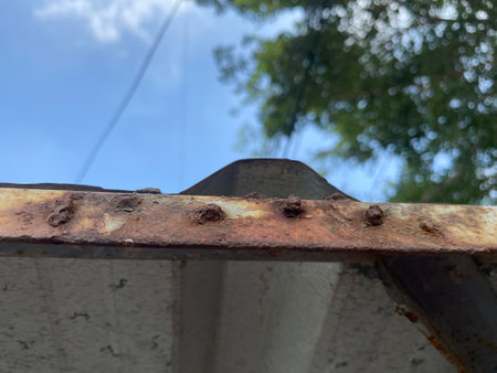 old rusty metal roof and blue skyの写真素材