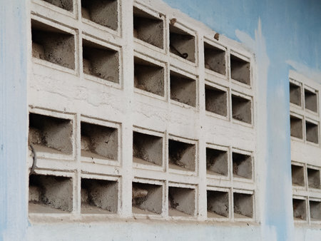 hole on cement wall of a buildingの写真素材