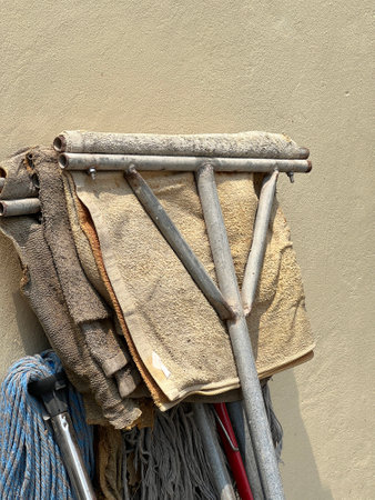 close up mop with fabric on cement wall
