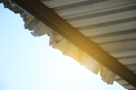 close up of a metal roof with blue skyの写真素材