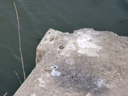 a closeup shot of the sea and rocks in the daytimeの写真素材